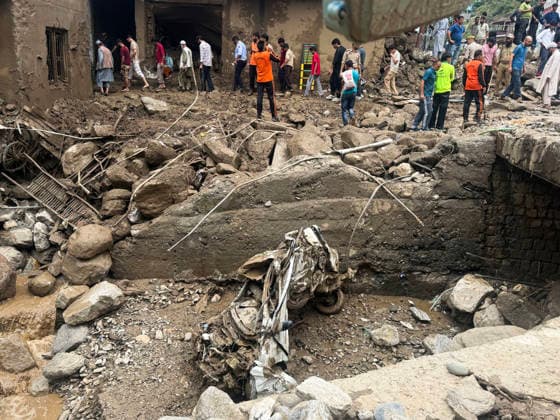 People walk over the debris that lies scattered after flood Doda, Jul 07 (ANI): People walk over the debris that lies scattered after flood, in Doda on Tuesday. Doda Jammu and Kashmir India Copyright: xANIx ANI_20260707327