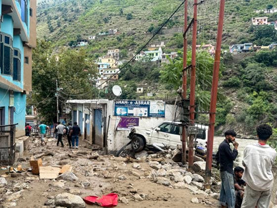 People walk over the debris that lies scattered after flood Doda, Jul 07 (ANI): People walk over the debris that lies scattered after flood, in Doda on Tuesday. Doda Jammu and Kashmir India Copyright: xANIx ANI_20260707329