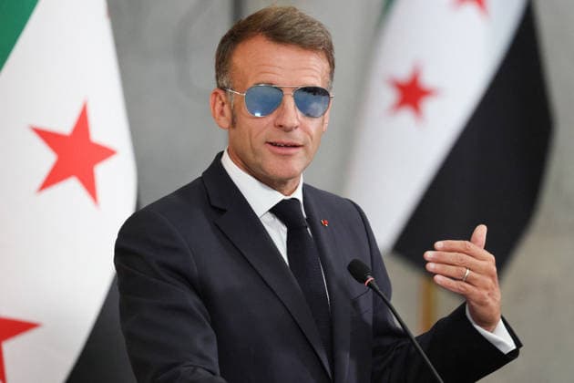 President Macron and President al-Sharaa Joint Press Conference - Damascus France s President Emmanuel Macron, wearing sunglasses, gestures as he speaks during a joint press conference with Syrian President in Damascus on July 7, 2026. French President Emmanuel Macron arrived in Damascus on July 6, 2026 for the first visit by a Western European head of state since Syria s new authorities took power in 2024, an AFP journalist said. Macron, who will depart on July 7, 2026, will advocate for a free, pluralist Syria that respects each of its components and plays a role in moderating Middle East tensions, the French presidency told journalists ahead of his arrival. Photo by Ludovic Marin Pool ABACAPRESS.COM Damascus Syria  Copyright: xMarinxLudovic Pool ABACAx