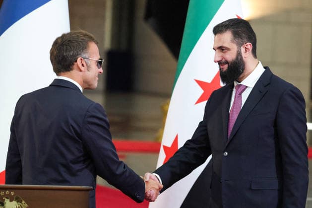 President Macron and President al-Sharaa Joint Press Conference - Damascus Syrian President Ahmed al-Sharaa (R) shakes hands with France s President Emmanuel Macron following a joint press conference in Damascus on July 7, 2026. French President Emmanuel Macron arrived in Damascus on July 6, 2026 for the first visit by a Western European head of state since Syria s new authorities took power in 2024, an AFP journalist said. Macron, who will depart on July 7, 2026, will advocate for a free, pluralist Syria that respects each of its components and plays a role in moderating Middle East tensions, the French presidency told journalists ahead of his arrival. Photo by Ludovic Marin Pool ABACAPRESS.COM Damascus Syria  Copyright: xMarinxLudovic Pool ABACAx