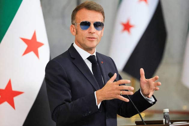 President Macron and President al-Sharaa Joint Press Conference - Damascus France s President Emmanuel Macron, wearing sunglasses, speaks during a joint press conference with Syrian President in Damascus on July 7, 2026. French President Emmanuel Macron arrived in Damascus on July 6, 2026 for the first visit by a Western European head of state since Syria s new authorities took power in 2024, an AFP journalist said. Macron, who will depart on July 7, 2026, will advocate for a free, pluralist Syria that respects each of its components and plays a role in moderating Middle East tensions, the French presidency told journalists ahead of his arrival. Photo by Ludovic Marin Pool ABACAPRESS.COM Damascus Syria  Copyright: xMarinxLudovic Pool ABACAx