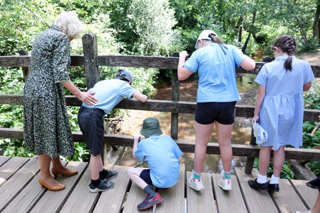 Queen Camilla visits Ashdown Forest Queen Camilla visits Ashdown Forest to commemorate 100 Years of Winnie-the-Pooh, in Ashdown Forest, Hartfield, East Sussex, UK, on the 7th July 2026. Picture by Chris Jackson WPA-Pool Hartfield Ashdown Forest East Sussex United Kingdom  WHA-0830
