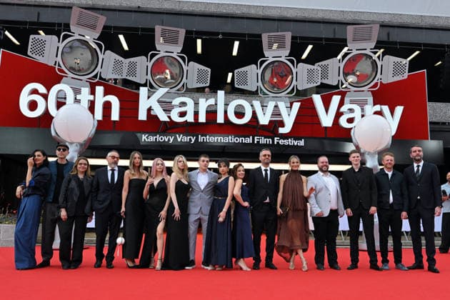 The 60th Karlovy Vary International Film Festival continued on its fifth day, in Karlovy Vary, Czech Republic, on July 7, 2026. A delegation of filmmakers presented the competition film Three Weeks Later (Serbia, Bulgaria, Italy, Croatia, Luxembourg) in the Grand Ballroom of the Thermal Hotel. Director Miroslav Terzic is standing the fourth from left (wearing glasses and a goatee beard). (CTKxPhoto SlavomirxKubes) CTKPhotoP2026070709532  CTKPhotoP2026070709532