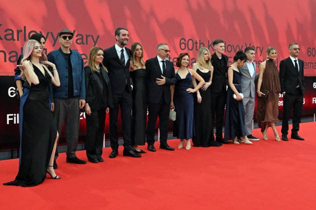 The 60th Karlovy Vary International Film Festival continued on its fifth day, in Karlovy Vary, Czech Republic, on July 7, 2026. A delegation of filmmakers presented the competition film Three Weeks Later (Serbia, Bulgaria, Italy, Croatia, Luxembourg) in the Grand Ballroom of the Thermal Hotel. Director Miroslav Terzic is standing in the middle (wearing glasses and a goatee beard). (CTKxPhoto SlavomirxKubes) CTKPhotoP2026070709521  CTKPhotoP2026070709521