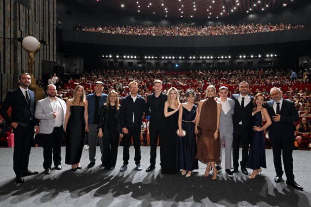The 60th Karlovy Vary International Film Festival continued on its fifth day, in Karlovy Vary, Czech Republic, on July 7, 2026. A delegation of filmmakers presented the competition film Three Weeks Later (Serbia, Bulgaria, Italy, Croatia, Luxembourg) in the Grand Ballroom of the Thermal Hotel. Director Miroslav Terzic is standing right (wearing glasses and a goatee beard). (CTKxPhoto SlavomirxKubes) CTKPhotoP2026070709544  CTKPhotoP2026070709544