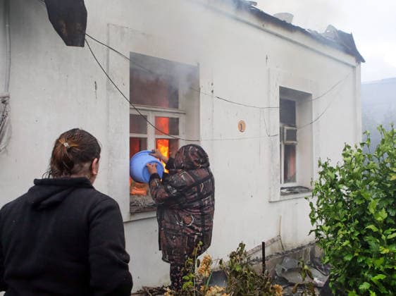 RECORD DATE NOT STATED A woman extinguishes a fire in a residential building following a massive combined Russian attack in Vyshneve, Kyiv region, Ukraine, on July 6, 2026. Russian forces launched a large-scale attack on the city and the region using ballistic and cruise missiles, as well as attack drones. Dozens of houses on five streets were destroyed, while warehouses and businesses sustained damage. More than 600 local residents were evacuated due to the detonation of explosive hazards. Six people were killed and at least 26 others were injured, including a nine-month-old baby and a 12-year-old child (Photo by Volodymyr Tarasov Ukrinform) Russian forces strike Zaporizhzhia with two guided bombs  Copyright: xVolodymyrxTarasovx