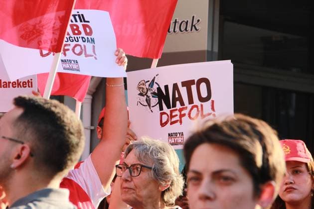 IZMIR, Türkiye July 7, 2026: Demonstrators march toward NATO s Allied Land Command (LANDCOM) headquarters in the Buca district of Ä°zmir during an anti-NATO protest organized by the NATO ya HayÄ±r Koordinasyonu (No to NATO Coordination), a coalition of left-wing political parties, trade unions and civil society organizations, ahead of the NATO Summit in Ankara, July 7, 2026. Police closed Mehmet Akif Avenue to traffic and deployed extensive security measures as protesters carried placards reading Trump, Netanyahu, you are not welcome and Yankee Go Home before delivering a public statement criticizing NATO and Turkish government policies outside the headquarters. Ä°zmir Türkiye Copyright: x xNagihanxÃ‡akÄ±rx xJNAxPressx