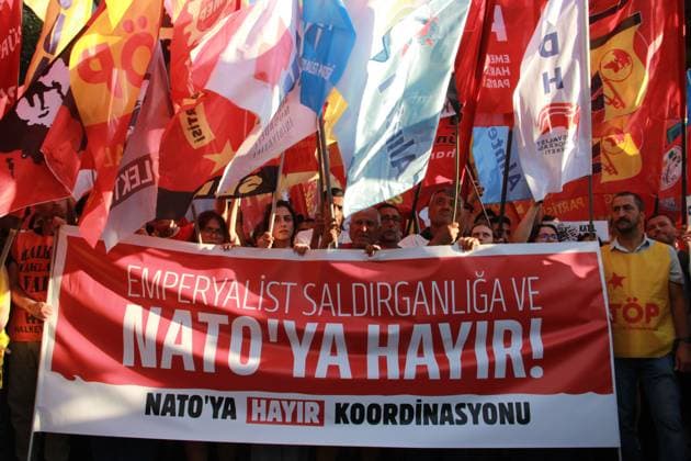 IZMIR, Türkiye July 7, 2026: Demonstrators march toward NATO s Allied Land Command (LANDCOM) headquarters in the Buca district of Ä°zmir during an anti-NATO protest organized by the NATO ya HayÄ±r Koordinasyonu (No to NATO Coordination), a coalition of left-wing political parties, trade unions and civil society organizations, ahead of the NATO Summit in Ankara, July 7, 2026. Police closed Mehmet Akif Avenue to traffic and deployed extensive security measures as protesters carried placards reading Trump, Netanyahu, you are not welcome and Yankee Go Home before delivering a public statement criticizing NATO and Turkish government policies outside the headquarters. Ä°zmir Türkiye Copyright: x xNagihanxÃ‡akÄ±rx xJNAxPressx