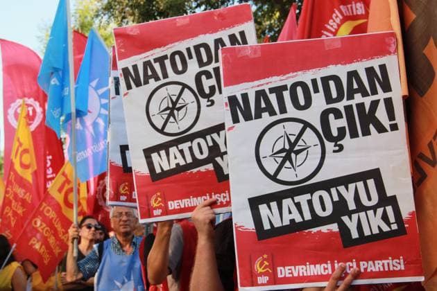 IZMIR, Türkiye July 7, 2026: Demonstrators march toward NATO s Allied Land Command (LANDCOM) headquarters in the Buca district of Ä°zmir during an anti-NATO protest organized by the NATO ya HayÄ±r Koordinasyonu (No to NATO Coordination), a coalition of left-wing political parties, trade unions and civil society organizations, ahead of the NATO Summit in Ankara, July 7, 2026. Police closed Mehmet Akif Avenue to traffic and deployed extensive security measures as protesters carried placards reading Trump, Netanyahu, you are not welcome and Yankee Go Home before delivering a public statement criticizing NATO and Turkish government policies outside the headquarters. Ä°zmir Türkiye Copyright: x xNagihanxÃ‡akÄ±rx xJNAxPressx