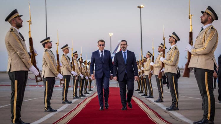 France s President Emmanuel Macron (C-L) is welcomed by Syria s Foreign Minister Asaad al-Shaibani (C-R) as he arrives for a state visit at the Damascus International Airport in Damascus in Syria, on Tuesday, July 6, 2026. Security sources reported that more than 15 people were injured in an explosion at a café in central Damascus, as French leader Emmanuel Macron made the first post-conflict visit to Damascus by a Western European leader.  SYR2026070707 SyrianxMinistryxofxForeignxAffai