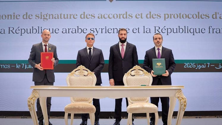 (From L) France s Foreign Affairs Minister Jean-Noel Barrot, France s President Emmanuel Macron, Syria s interim president Ahmed al-Sharaa and Syria s Foreign Minister Asaad al-Shaibani pose after signing a Framework Agreement on Bilateral Cooperation an agreement signing ceremony in Damascus in Syria, on Tuesday, July 7, 2026. Security sources reported that more than 15 people were injured in an explosion at a café in central Damascus, as French leader Emmanuel Macron made the first post-conflict visit to Damascus by a Western European leader.  SYR2026070711 SyrianxMinistryxofxForeignxAffai