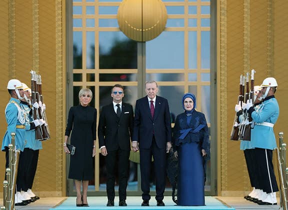 Turkey s President Tayyip Erdogan (CR) and his wife Emine Erdogan (R) welcoming France s President Emmanuel Macron (CL) and his wife Brigitte Macron (L) during a reception hosted for heads of stade and government attending the 36th NATO Heads of State and Government Summit at the Presidential Complex in Ankara, on Tuesday, July 7, 2026.  TUR2026070737 TurkishxPresidencyxOffice