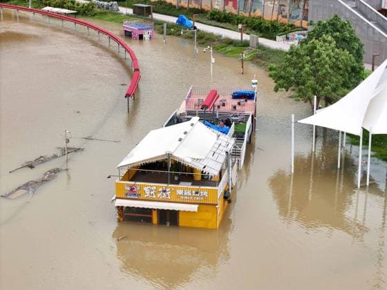 NANNING, CHINA - JULY 07: Floodwaters submerge riverside walkways and shops on July 7, 2026 in Nanning, Guangxi Zhuang Autonomous Region of China. Recent extreme rainstorms triggered by Typhoon Maysak, the 10th typhoon of the year, have caused severe flooding in parts of south China s Guangxi Zhuang Autonomous Region.  Copyright: xVCGx 111652813943