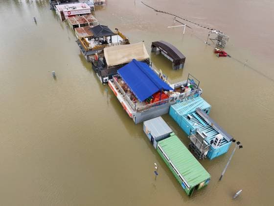 NANNING, CHINA - JULY 07: Floodwaters submerge riverside walkways and shops on July 7, 2026 in Nanning, Guangxi Zhuang Autonomous Region of China. Recent extreme rainstorms triggered by Typhoon Maysak, the 10th typhoon of the year, have caused severe flooding in parts of south China s Guangxi Zhuang Autonomous Region.  Copyright: xVCGx 111652813950