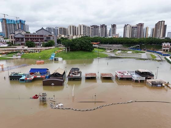 NANNING, CHINA - JULY 07: Floodwaters submerge riverside walkways and shops on July 7, 2026 in Nanning, Guangxi Zhuang Autonomous Region of China. Recent extreme rainstorms triggered by Typhoon Maysak, the 10th typhoon of the year, have caused severe flooding in parts of south China s Guangxi Zhuang Autonomous Region.  Copyright: xVCGx 111652813951