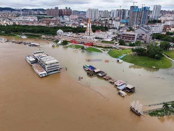 NANNING, CHINA - JULY 07: Floodwaters submerge riverside walkways and shops on July 7, 2026 in Nanning, Guangxi Zhuang Autonomous Region of China. Recent extreme rainstorms triggered by Typhoon Maysak, the 10th typhoon of the year, have caused severe flooding in parts of south China s Guangxi Zhuang Autonomous Region.  Copyright: xVCGx 111652813959