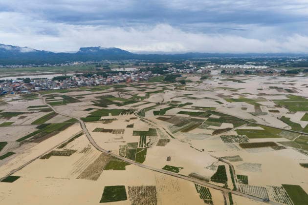 NANNING, CHINA - JULY 07: Floodwaters submerge fields of Linjiang village on July 7, 2026 in Hengzhou, Nanning, Guangxi Zhuang Autonomous Region of China. Recent extreme rainstorms triggered by Typhoon Maysak, the 10th typhoon of the year, have caused severe flooding in parts of south China s Guangxi Zhuang Autonomous Region.  Copyright: xVCGx 111652981416