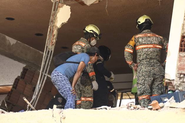 Aftermath of the Earthquake in Caraballeda, La Guaira, Venezuela CARABALLEDA, VENEZUELA JULY 7, 2026: Aura Milena Rodriguez stands among the ruins of her destroyed home in Caraballeda, La Guaira, as she searches for any trace of her son, JosÃ Miguel Gonzalez Rodriguez, 25, a Spanish citizen who has been missing since the powerful earthquakes struck Venezuela on June 24. Accompanied by rescue teams, Rodriguez returned to the collapsed building where her son was last seen, clinging to hope as search and recovery operations continue. Spanish authorities have confirmed the deaths of 35 Spanish citizens, while 140 others remain missing, including JosÃ Miguel. The earthquakes have killed at least 3,685 people, displaced nearly 18,000 re Copyright: x xLauraxdexChiclanax xJNAxPressx
