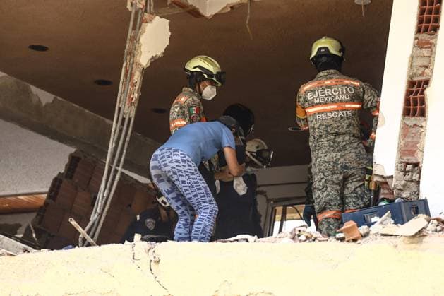 Aftermath of the Earthquake in Caraballeda, La Guaira, Venezuela CARABALLEDA, VENEZUELA JULY 7, 2026: Aura Milena Rodriguez stands among the ruins of her destroyed home in Caraballeda, La Guaira, as she searches for any trace of her son, JosÃ Miguel Gonzalez Rodriguez, 25, a Spanish citizen who has been missing since the powerful earthquakes struck Venezuela on June 24. Accompanied by rescue teams, Rodriguez returned to the collapsed building where her son was last seen, clinging to hope as search and recovery operations continue. Spanish authorities have confirmed the deaths of 35 Spanish citizens, while 140 others remain missing, including JosÃ Miguel. The earthquakes have killed at least 3,685 people, displaced nearly 18,000 re Copyright: x xLauraxdexChiclanax xJNAxPressx