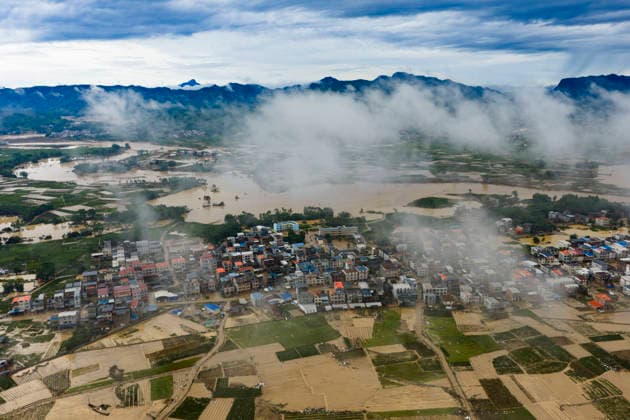 NANNING, CHINA - JULY 07: Floodwaters submerge fields of Linjiang village on July 7, 2026 in Hengzhou, Nanning, Guangxi Zhuang Autonomous Region of China. Recent extreme rainstorms triggered by Typhoon Maysak, the 10th typhoon of the year, have caused severe flooding in parts of south China s Guangxi Zhuang Autonomous Region.  Copyright: xVCGx 111652981420