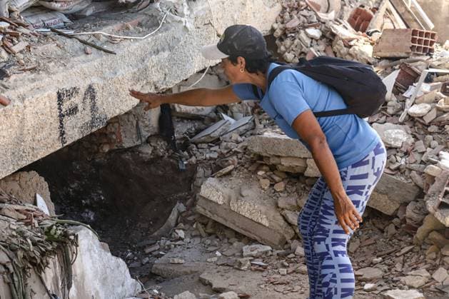 Aftermath of the Earthquake in Caraballeda, La Guaira, Venezuela CARABALLEDA, VENEZUELA JULY 7, 2026: Aura Milena Rodriguez stands among the ruins of her destroyed home in Caraballeda, La Guaira, as she searches for any trace of her son, JosÃ Miguel Gonzalez Rodriguez, 25, a Spanish citizen who has been missing since the powerful earthquakes struck Venezuela on June 24. Accompanied by rescue teams, Rodriguez returned to the collapsed building where her son was last seen, clinging to hope as search and recovery operations continue. Spanish authorities have confirmed the deaths of 35 Spanish citizens, while 140 others remain missing, including JosÃ Miguel. The earthquakes have killed at least 3,685 people, displaced nearly 18,000 re Copyright: x xLauraxdexChiclanax xJNAxPressx