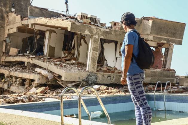 Aftermath of the Earthquake in Caraballeda, La Guaira, Venezuela CARABALLEDA, VENEZUELA JULY 7, 2026: Aura Milena Rodriguez stands among the ruins of her destroyed home in Caraballeda, La Guaira, as she searches for any trace of her son, JosÃ Miguel Gonzalez Rodriguez, 25, a Spanish citizen who has been missing since the powerful earthquakes struck Venezuela on June 24. Accompanied by rescue teams, Rodriguez returned to the collapsed building where her son was last seen, clinging to hope as search and recovery operations continue. Spanish authorities have confirmed the deaths of 35 Spanish citizens, while 140 others remain missing, including JosÃ Miguel. The earthquakes have killed at least 3,685 people, displaced nearly 18,000 re Copyright: x xLauraxdexChiclanax xJNAxPressx