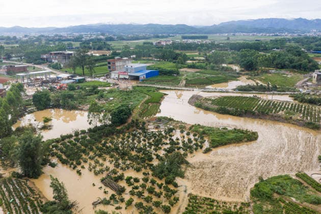 NANNING, CHINA - JULY 07: Floodwaters submerge farmland of Linjiang village on July 7, 2026 in Hengzhou, Nanning, Guangxi Zhuang Autonomous Region of China. Recent extreme rainstorms triggered by Typhoon Maysak, the 10th typhoon of the year, have caused severe flooding in parts of south China s Guangxi Zhuang Autonomous Region.  Copyright: xVCGx 111652981409