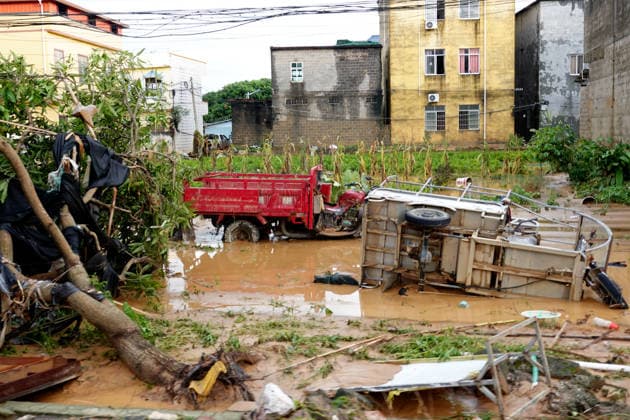 NANNING, CHINA - JULY 07: An agricultural vehicle is overturned in flood waters on July 7, 2026 in Hengzhou, Nanning, Guangxi Zhuang Autonomous Region of China. Recent extreme rainstorms triggered by Typhoon Maysak, the 10th typhoon of the year, have caused severe flooding in parts of south China s Guangxi Zhuang Autonomous Region.  Copyright: xVCGx 111652981462
