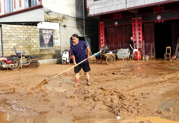 NANNING, CHINA - JULY 07: A villager clears mud and silt from his house on July 7, 2026 in Hengzhou, Nanning, Guangxi Zhuang Autonomous Region of China. Recent extreme rainstorms triggered by Typhoon Maysak, the 10th typhoon of the year, have caused severe flooding in parts of south China s Guangxi Zhuang Autonomous Region.  Copyright: xVCGx 111652981451