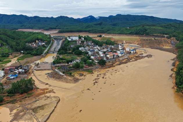 NANNING, CHINA - JULY 07: Floodwaters rush from a breach in the Liulan Reservoir dam following heavy rainfall brought by Typhoon Maysak on July 7, 2026 in Hengzhou, Nanning, Guangxi Zhuang Autonomous Region of China. Recent extreme rainstorms triggered by Typhoon Maysak, the 10th typhoon of the year, have caused severe flooding in parts of south China s Guangxi Zhuang Autonomous Region.  Copyright: xVCGx 111652872167