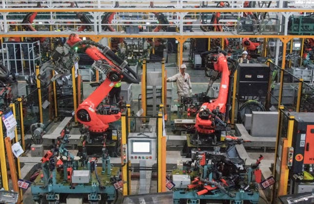 JINHUA, CHINA - JULY 07: Industrial robots process new energy vehicle parts at the intelligent production workshop of Zhejiang Zhixin Technology Co., Ltd. on July 7, 2026 in Jinhua, Zhejiang Province of China. The workshop is dedicated to the production of components for new energy vehicles.  Copyright: xVCGx 111652845286