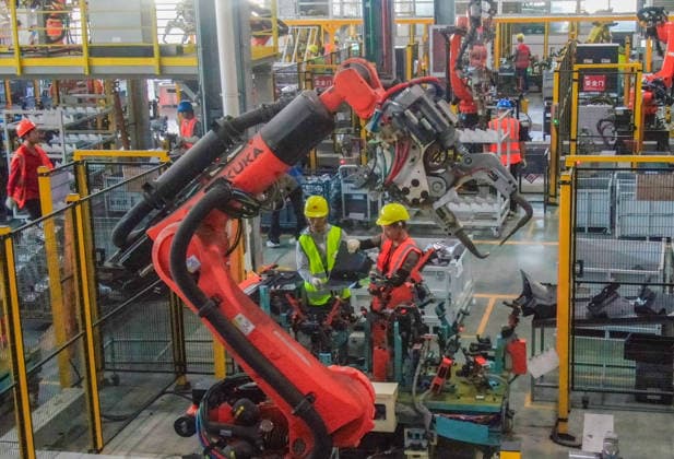 JINHUA, CHINA - JULY 07: Industrial robots process new energy vehicle parts at the intelligent production workshop of Zhejiang Zhixin Technology Co., Ltd. on July 7, 2026 in Jinhua, Zhejiang Province of China. The workshop is dedicated to the production of components for new energy vehicles.  Copyright: xVCGx 111652845287