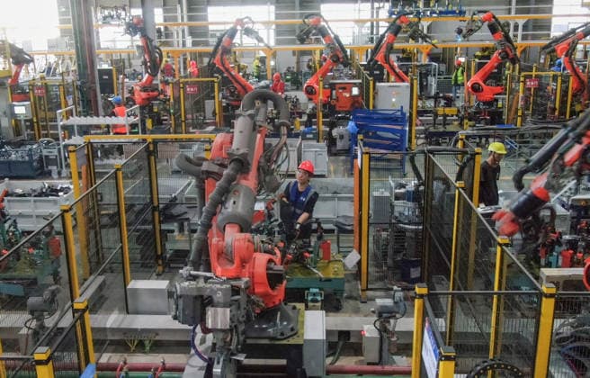 JINHUA, CHINA - JULY 07: Industrial robots process new energy vehicle parts at the intelligent production workshop of Zhejiang Zhixin Technology Co., Ltd. on July 7, 2026 in Jinhua, Zhejiang Province of China. The workshop is dedicated to the production of components for new energy vehicles.  Copyright: xVCGx 111652845288