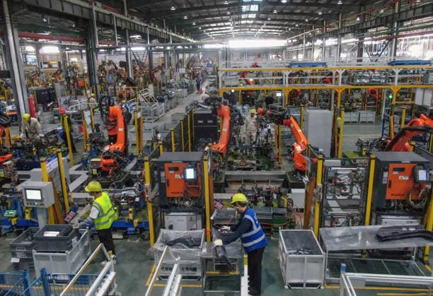 JINHUA, CHINA - JULY 07: Industrial robots process new energy vehicle parts at the intelligent production workshop of Zhejiang Zhixin Technology Co., Ltd. on July 7, 2026 in Jinhua, Zhejiang Province of China. The workshop is dedicated to the production of components for new energy vehicles.  Copyright: xVCGx 111652845290
