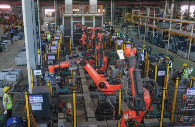 JINHUA, CHINA - JULY 07: Industrial robots process new energy vehicle parts at the intelligent production workshop of Zhejiang Zhixin Technology Co., Ltd. on July 7, 2026 in Jinhua, Zhejiang Province of China. The workshop is dedicated to the production of components for new energy vehicles.  Copyright: xVCGx 111652845291