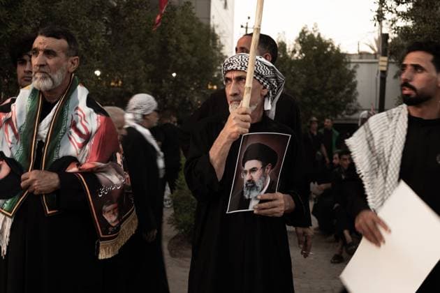 Crowds Gather for Funeral Procession in Najaf NAJAF, IRAQ JULY 8, 2026: Crowds gather ahead of the funeral procession for Ali Khamenei in Najaf, Iraq. Participants carried flags and portraits as large numbers of mourners assembled along the procession route under extensive organizational and security arrangements. NAJAF IQ Copyright: x xMohammedxzahidx xJNAxPressx