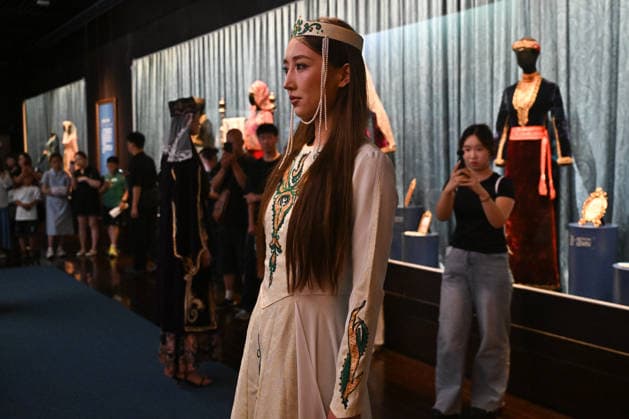 TAIYUAN, CHINA - JULY 08: A model wears traditional Armenian clothing to display artifacts during the opening of the Land of Noah exhibition at Shanxi Museum on July 8, 2026 in Taiyuan, Shanxi Province of China. The exhibition features 134 sets of precious artifacts from the Yerevan History Museum in Armenia, including traditional clothing, silverware, musical instruments, carpets, embroidery, oil paintings and pottery.  Copyright: xChinaxNewsxServicex 111653053323