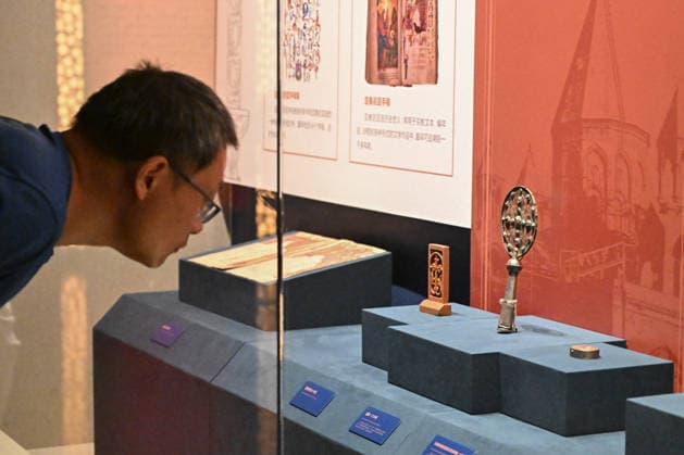 TAIYUAN, CHINA - JULY 08: Visitors view a liturgical fan cast in 1729 at the Land of Noah exhibition featuring premium artifacts from the Yerevan History Museum in Armenia on July 8, 2026 in Taiyuan, Shanxi Province of China. The exhibition displays 134 sets of cultural relics including traditional costumes, silverware, musical instruments, carpets, embroidery, oil paintings and ceramics.  Copyright: xChinaxNewsxServicex 111653053328