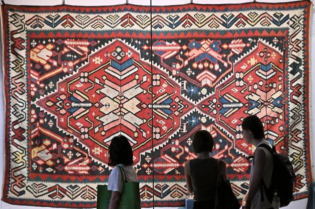 TAIYUAN, CHINA - JULY 08: Visitors view a 19th-century Armenian carpet at the Shanxi Museum on July 8, 2026 in Taiyuan, Shanxi Province of China. The exhibition Land of Noah: Masterpieces from the Yerevan History Museum of Armenia features 134 sets of artifacts including traditional costumes, silverware, musical instruments, carpets, embroidery, oil paintings and pottery.  Copyright: xChinaxNewsxServicex 111653054052