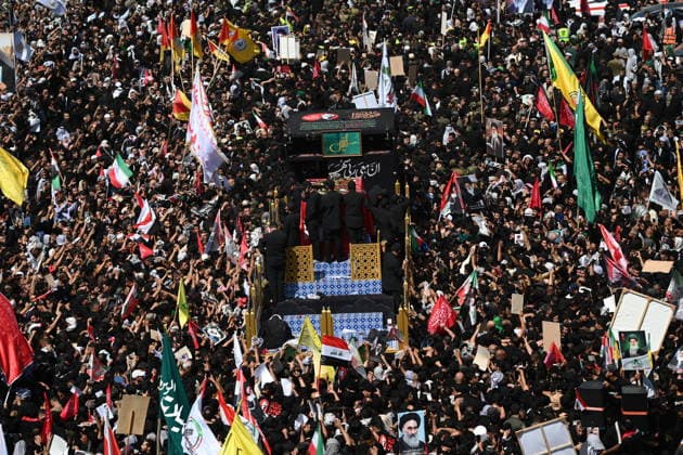 Thousands gather in Iraq for funeral procession of slain Iranian leader Khamenei NAJAF, IRAQ - JULY 8: A massive crowd of mourners carrying flags and posters fills the streets as the coffins of Iranian supreme leader Ali Khamenei and his family members are carried among the public inside a specially designed truck resembling the Imam Reza Shrine during a farewell ceremony in Najaf, Iraq, on July 8, 2026. Khamenei lost his life following joint US-Israeli attacks, drawing thousands to the squares and avenues since the early hours of the morning. Haidar Mohammed Ali Anadolu Najaf Iraq. Editorial use only. Please get in touch for any other usage.  Copyright: x2026xAnadoluxHaidarxMohammedxAlix