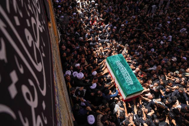 Farewell ceremony held for Iran s former leader Ali Khamenei in Najaf NAJAF, IRAQ - JULY 8: Large crowds carrying flags and posters attend the farewell ceremony held for former Iranian leader Ali Khamenei, who was killed in U.S.-Israeli attacks as in Najaf, Iran on July 8, 2026. The coffins of Khamenei and his family members are transported through the crowd in a specially designed truck after the Imam Reza Shrine before being brought to the Imam Ali Shrine. Karar Essa Anadolu Najaf Iraq. Editorial use only. Please get in touch for any other usage.  Copyright: x2026xAnadoluxKararxEssax