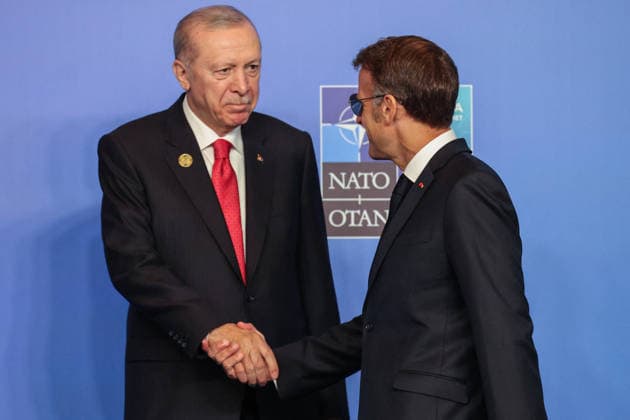 NATO Leaders Summit - Ankara Turkey s President Recep Tayyip Erdogan greets France s President Emmanuel Macron (R) as he arrives for a NATO Summit at Bestepe Presidential Compound in Ankara, Turkey, July 8, 2026. The summit comes at a fraught time for the 77-year-old transatlantic alliance, with the US President demanding members make good on a pledge to ramp up defence spending as Washington takes a step back from Europe. Photo by Ludovic Marin Pool ABACAPRESS.COM Ankara Turkey  Copyright: xMarinxLudovic Pool ABACAx