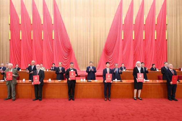 (260708) -- BEIJING, July 8, 2026 -- Xi Jinping and other leaders of the Communist Party of China and the state, together with the two winners of the national top sci-tech award, present certificates to representatives of recipients of the State Natural Science Award, the State Technological Invention Award, the State Scientific and Technological Progress Award and the China International Science and Technology Cooperation Award at the Great Hall of the People in Beijing, capital of China, July 8, 2026. A meeting bringing together the national science and technology award conference, the general assemblies of the members of the Chinese Academy of Sciences (CAS) and the Chinese Academy of Engineering (CAE), and the 11th national congress of 