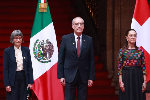Swiss President Guy Parmelin in Mexico MEXICO CITY, MEXICO - JULY 08: Swiss President Guy Parmelin (C) accompanied by his wife Caroline Merotto (L) is received by Mexico s President Claudia Sheinbaum (R) during a welcome ceremony, at the National Palace, in Mexico City, Mexico on July 08, 2026. The visit of Swiss President Guy Parmelin to Mexico aims to strengthen bilateral economic and trade relations, as well as to promote new investment opportunities between both nations and advance the modernization of the EFTA free trade agreement. Daniel Cardenas Anadolu Mexico City Mexico. Editorial use only. Please get in touch for any other usage.  Copyright: x2026xAnadoluxDanielxCardenasx