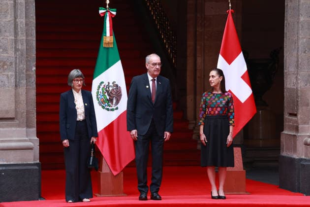 Swiss President Guy Parmelin in Mexico MEXICO CITY, MEXICO - JULY 08: Swiss President Guy Parmelin (C) accompanied by his wife Caroline Merotto (L) is received by Mexico s President Claudia Sheinbaum (R) during a welcome ceremony, at the National Palace, in Mexico City, Mexico on July 08, 2026. The visit of Swiss President Guy Parmelin to Mexico aims to strengthen bilateral economic and trade relations, as well as to promote new investment opportunities between both nations and advance the modernization of the EFTA free trade agreement. Daniel Cardenas Anadolu Mexico City Mexico. Editorial use only. Please get in touch for any other usage.  Copyright: x2026xAnadoluxDanielxCardenasx