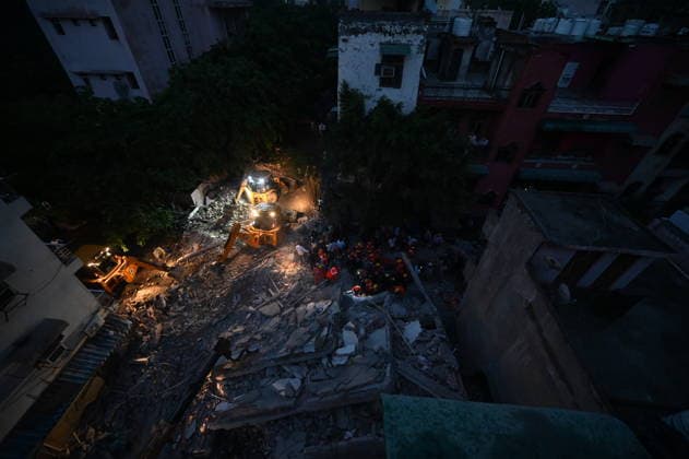 NEW DELHI, INDIA - JULY 8: NDRF personnel rescue a survivor trapped under the debris after a building collapsed in G Block, Sector 16, Rohini on July 8, 2026 in New Delhi, India. Rescue operations were launched immediately, with multiple emergency agencies deployed to search for and evacuate those trapped beneath the rubble. (Photo by Ishant Chauhan Hindustan Times) Man Killed As Under-Construction Building Collapses In Delhi s Rohini Sector 16