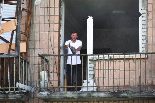 RECORD DATE NOT STATED A man stands on the balcony of a five-storey residential building damaged by a Russian missile strike, Kharkiv, Ukraine, on July 8, 2026. The Russian army launched a missile attack on a five-storey residential building in the city’s Nemyshlianskyi district, partially destroying the fifth floor. Two people were killed and at least 23 residents, including four children, were injured (Photo by Viacheslav Madiievskyi Ukrinform) Russia strikes five-storey residential building in Kharkiv with missile  Copyright: xViacheslavxMadiievskyix