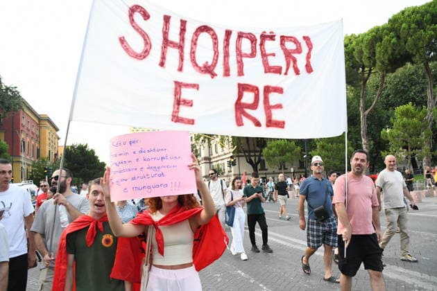 Protests continue in Albania against the planned tourism project in Zvernec TIRANA, ALBANIA - JULY 8: Demonstrators holding Albanian flag and posters gather at Skanderbeg Square during the 39th consecutive day of protests held under the slogan Albania is Not for Sale, opposing a planned tourism project in the Zvernec area of Vlore, in Tirana, Albania, on July 8, 2026. Olsi Shehu Anadolu Tirana Albania. Editorial use only. Please get in touch for any other usage.  Copyright: x2026xAnadoluxOlsixShehux