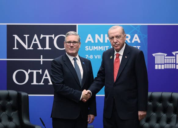 Britain s Prime Minister Keir Starmer, left, and Turkish President Recep Tayyip Erdogan shake hands after signing a defense partnership agreement on the sidelines of the NATO summit in Ankara, Turkey, Wednesday, July 8, 2026.  TUR2026070836 TurkishxPresidencyxOffice