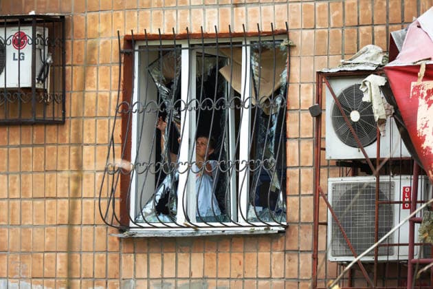 Russia strikes five-storey residential building in Kharkiv with missile A woman stands at the window of a five-storey residential building damaged by a Russian missile strike, Kharkiv, Ukraine, on July 8, 2026. The Russian army launched a missile attack on a five-storey residential building in the city™s Nemyshlianskyi district, partially destroying the fifth floor. Two people were killed and at least 23 residents, including four children, were injured, Credit:Viacheslav Madiievskyi Ukrinform Avalon Ukraine, Kharkiv  Copyright: xViacheslavxMadiievskyix xUkrinformx xAvalonx 1115317271